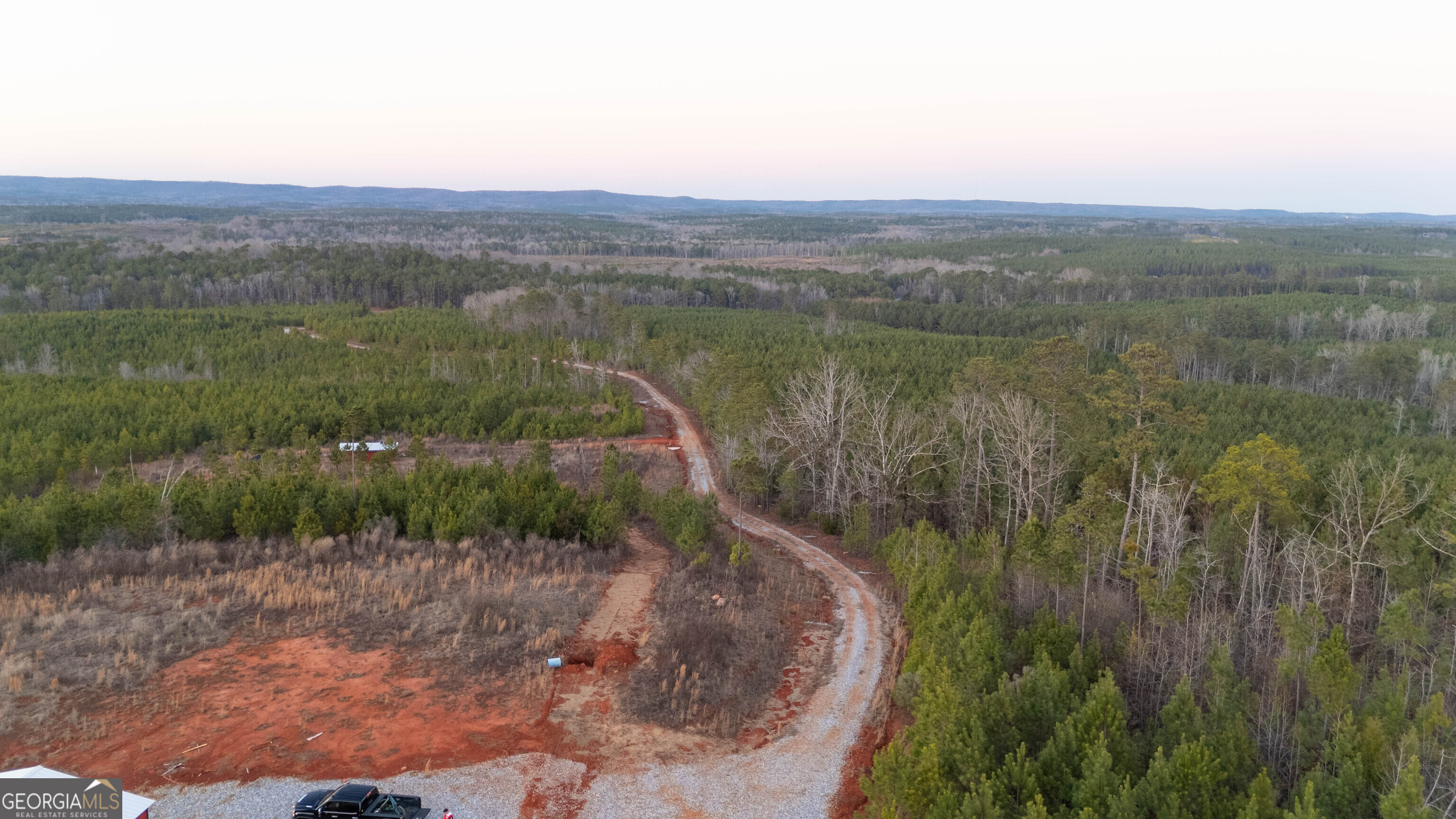 723 Brown Creek Road Shiloh, GA 31826 - Photo 7 of 14 a view of a lake with a yard