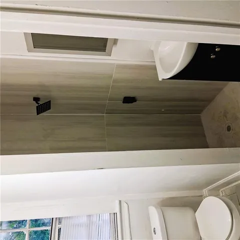 a bathroom with a bathtub and shower