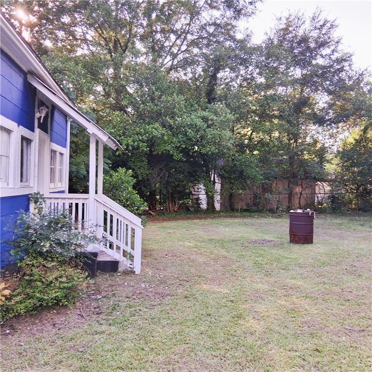 3435 Hillcrest Road Macon, GA 31204 - Photo 14 of 14 a view of a house with backyard and trees