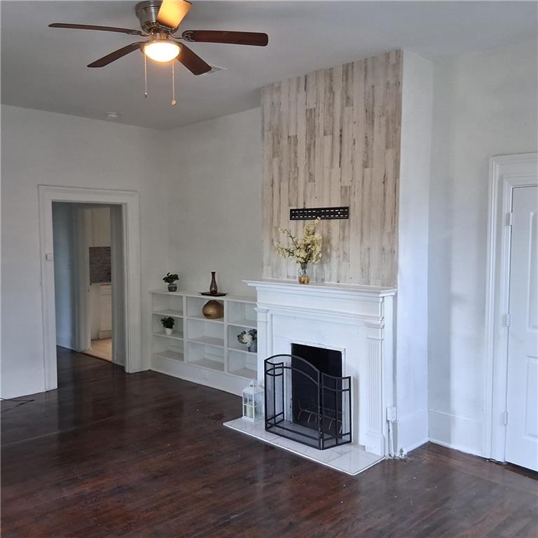 3435 Hillcrest Road Macon, GA 31204 - Photo 6 of 14 a view of a livingroom with a fireplace and wooden floor