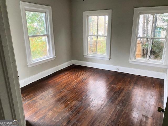 3435 Hillcrest Road Macon, GA 31204 - Photo 8 of 14 a view of an empty room with wooden floor and a window