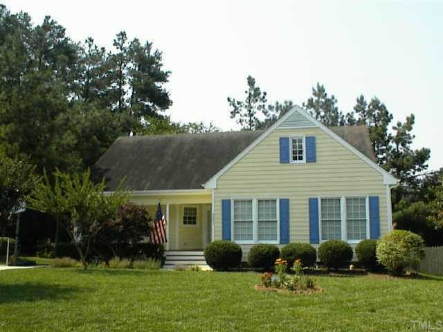 5237 Knightsbridge Way Raleigh, NC 27604 - Photo 1 of 1 a front view of a house with garden and porch