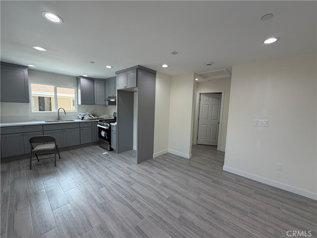 321 Elm Street Alhambra, CA 91801 - Photo 4 of 11 a kitchen with stainless steel appliances a refrigerator and wooden floor