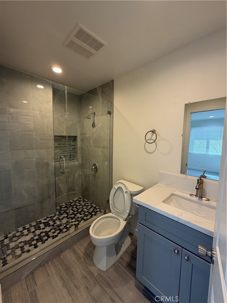 321 Elm Street Alhambra, CA 91801 - Photo 7 of 11 a bathroom with a sink a toilet a shower and a mirror