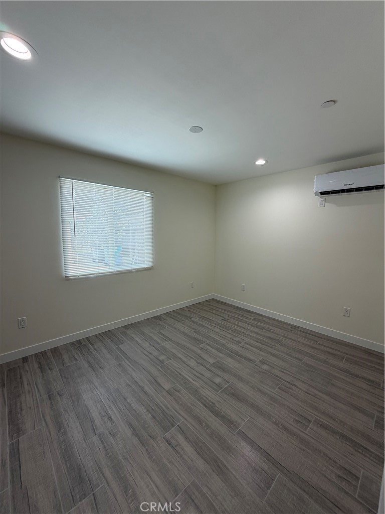 321 Elm Street Alhambra, CA 91801 - Photo 9 of 11 an empty room with wooden floor and windows