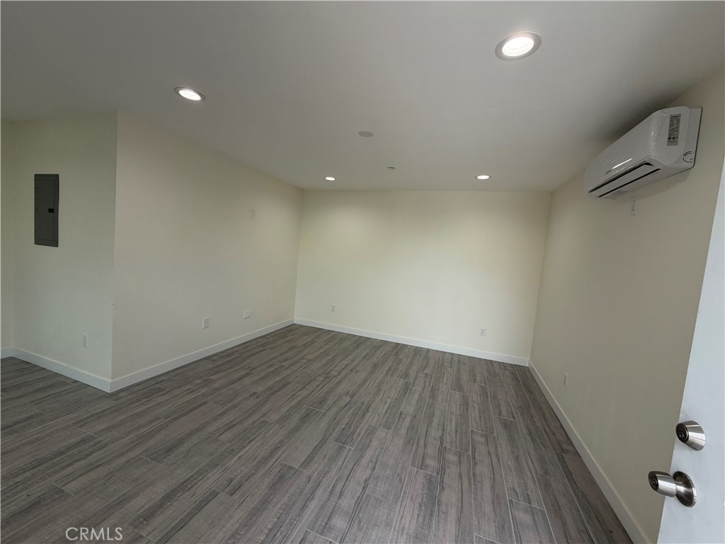 321 Elm Street Alhambra, CA 91801 - Photo 10 of 11 a view of an empty room with wooden floor and a window
