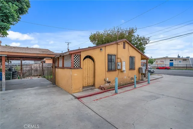 a front view of a house with basket ball court