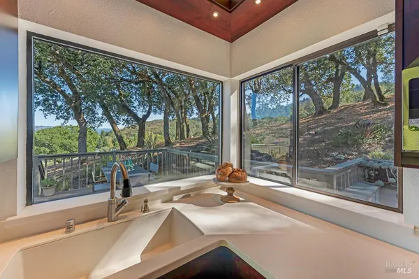 a bathroom with a sink and a large window