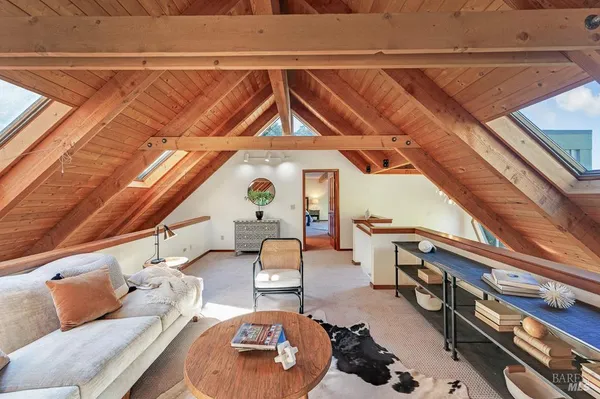 a living room with furniture and a rug