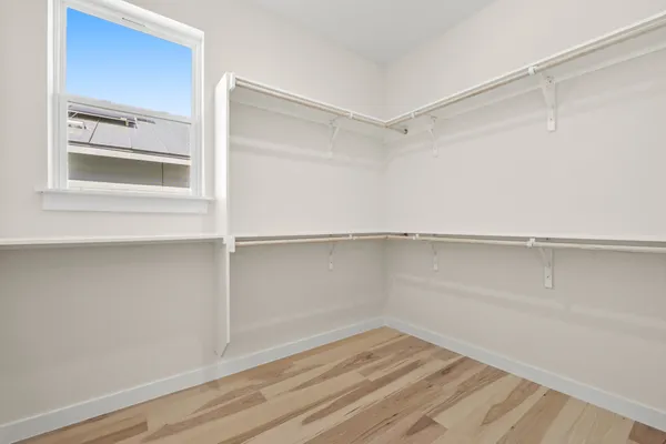 a view of an empty walk in closet