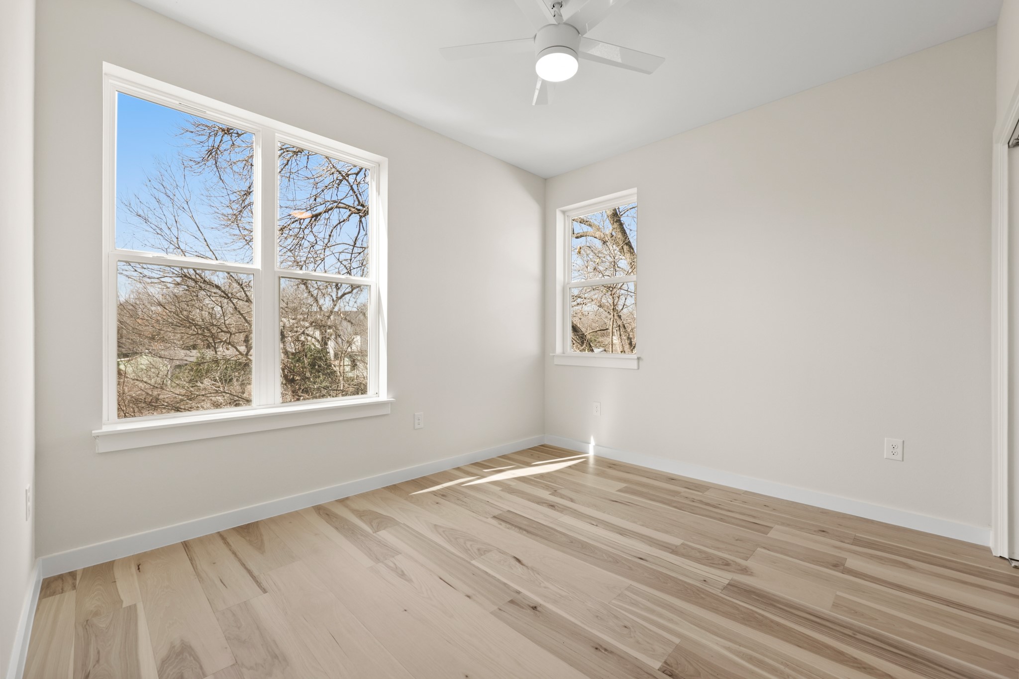4801 Sara Drive, Unit B Austin, TX 78721 - Photo 17 of 40 an empty room with windows