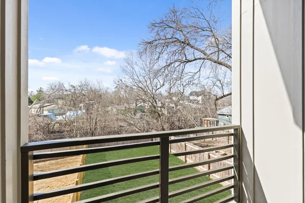 a view of a glass door and a window
