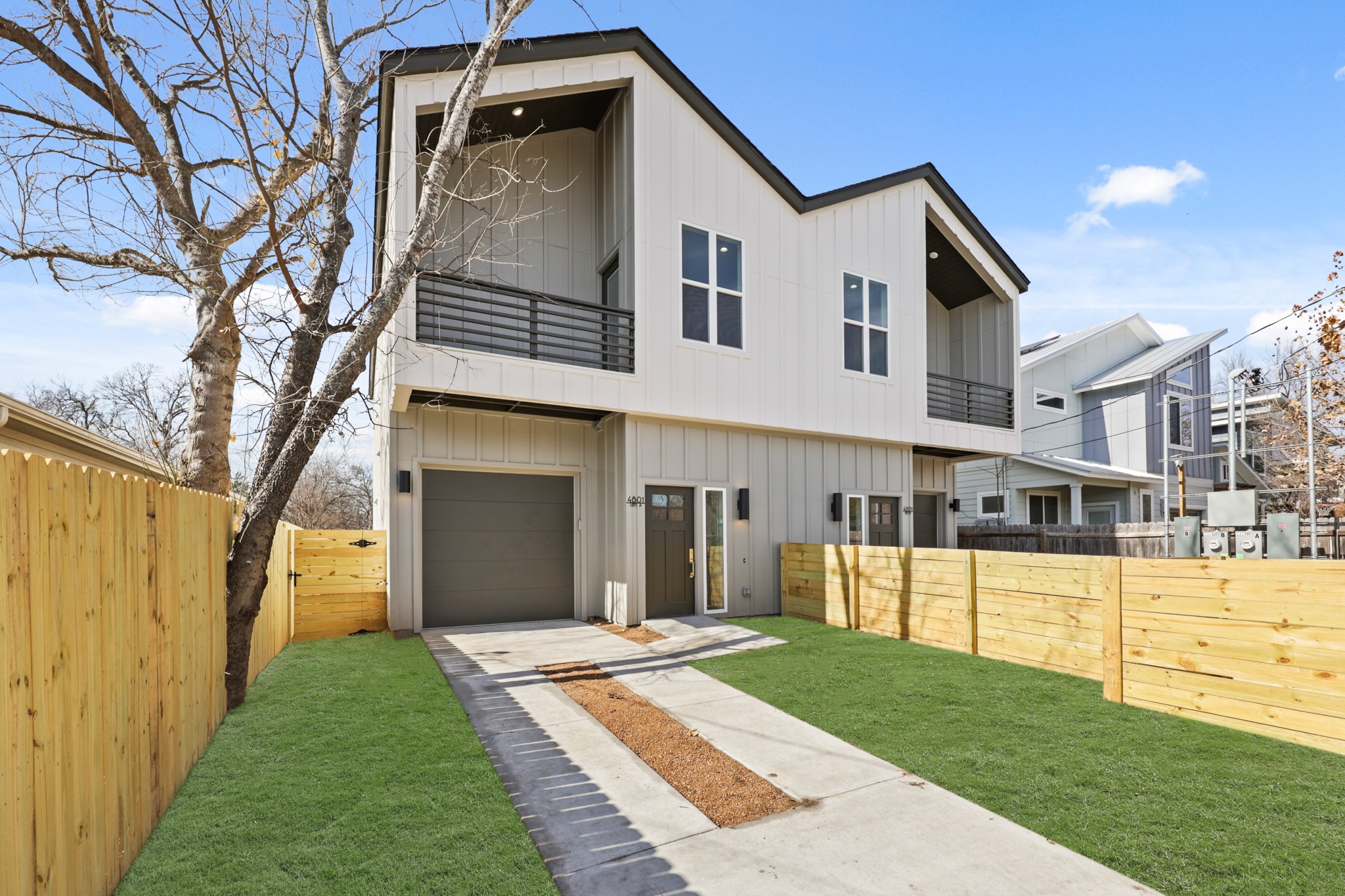 4801 Sara Drive, Unit B Austin, TX 78721 - Photo 21 of 40 a front view of a house with a yard and garage