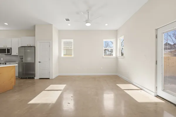 a view of an empty room with a window