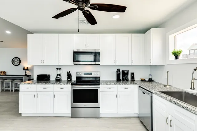 a view of a dining room kitchen and a window