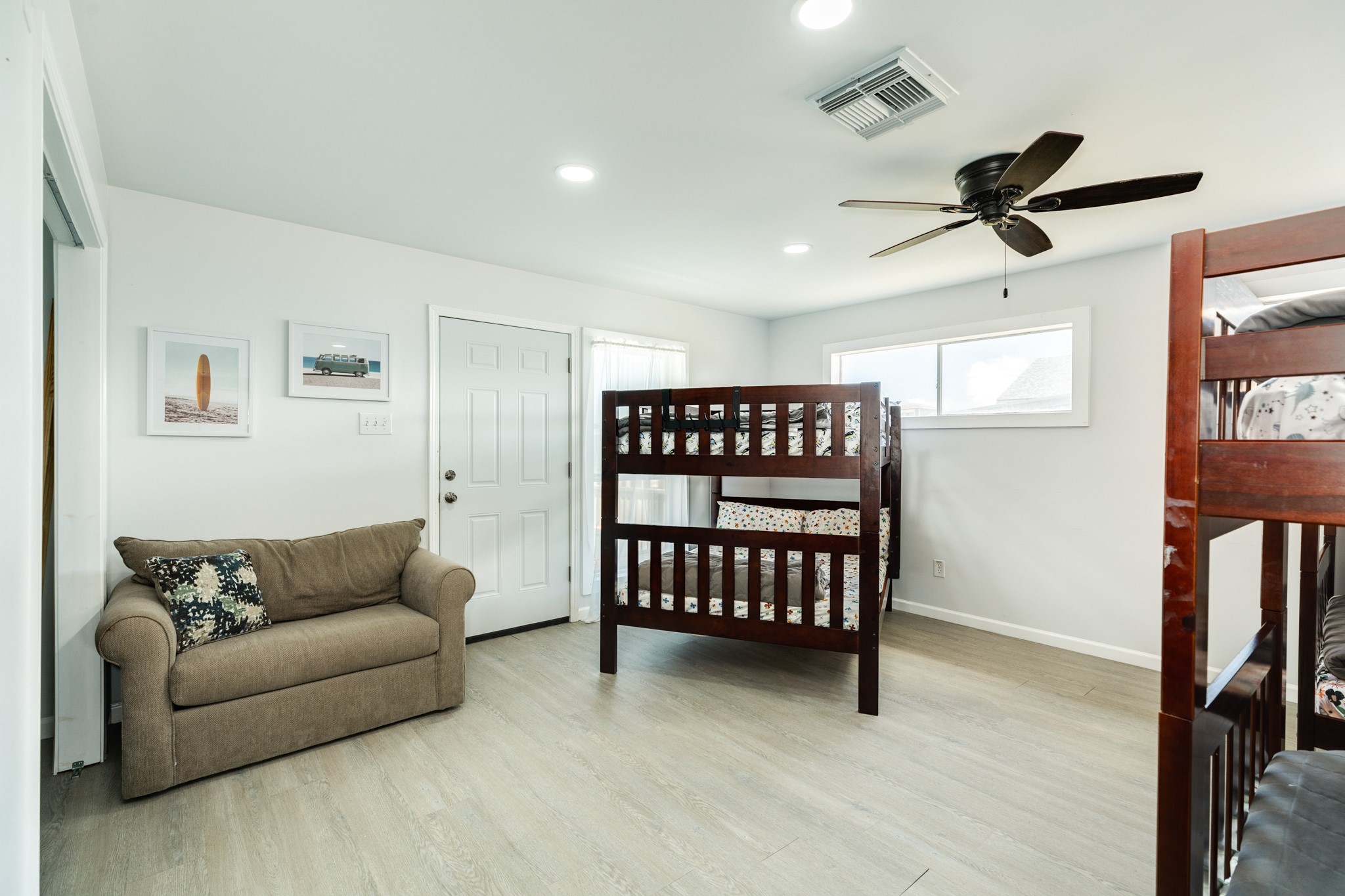 315 Seashell Drive Surfside Beach, TX 77541 - Photo 17 of 33 a living room with furniture a ceiling fan and a window
