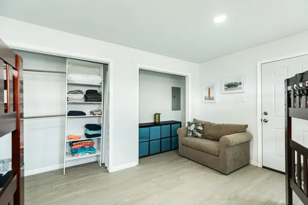 a living room with furniture a ceiling fan and a window