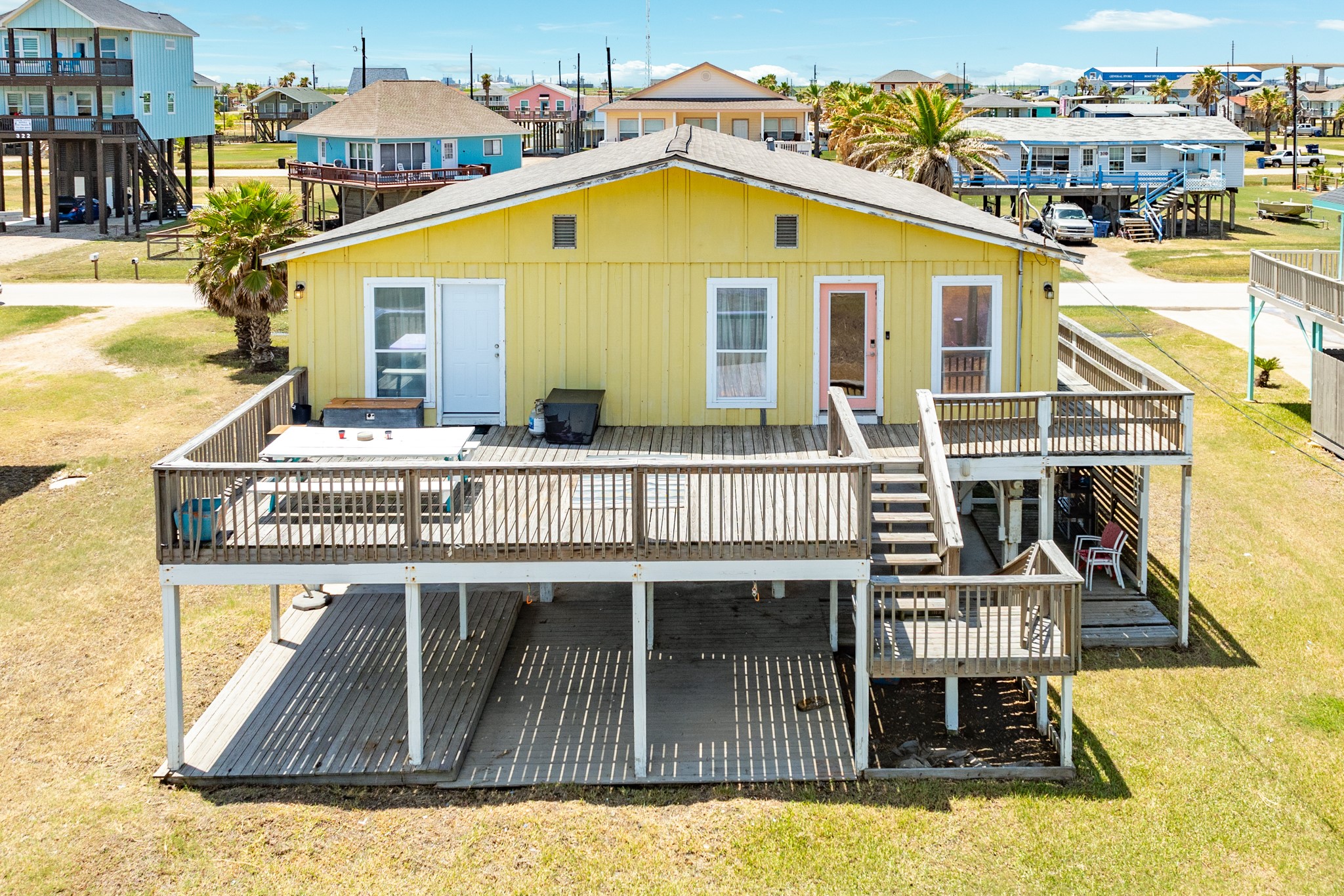 315 Seashell Drive Surfside Beach, TX 77541 - Photo 22 of 33 a view of a house with wooden deck