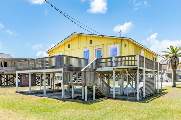 a house view with swimming pool and sitting space