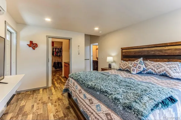 a bedroom with a bed and a dresser