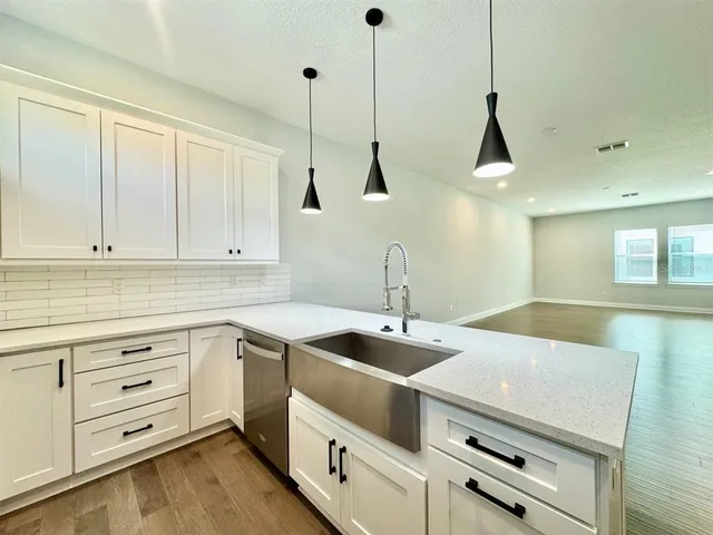 a kitchen with appliances and cabinets