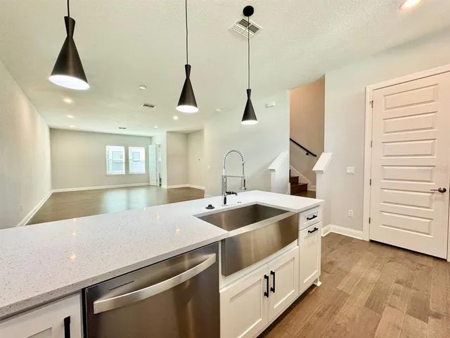 a kitchen with a sink and a stove