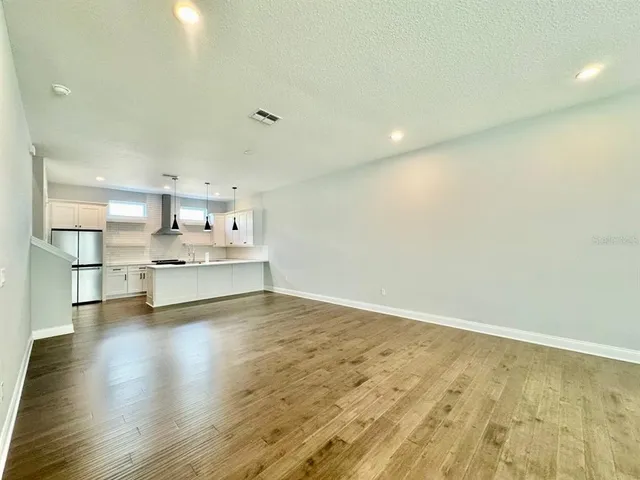 a view of kitchen with wooden floor