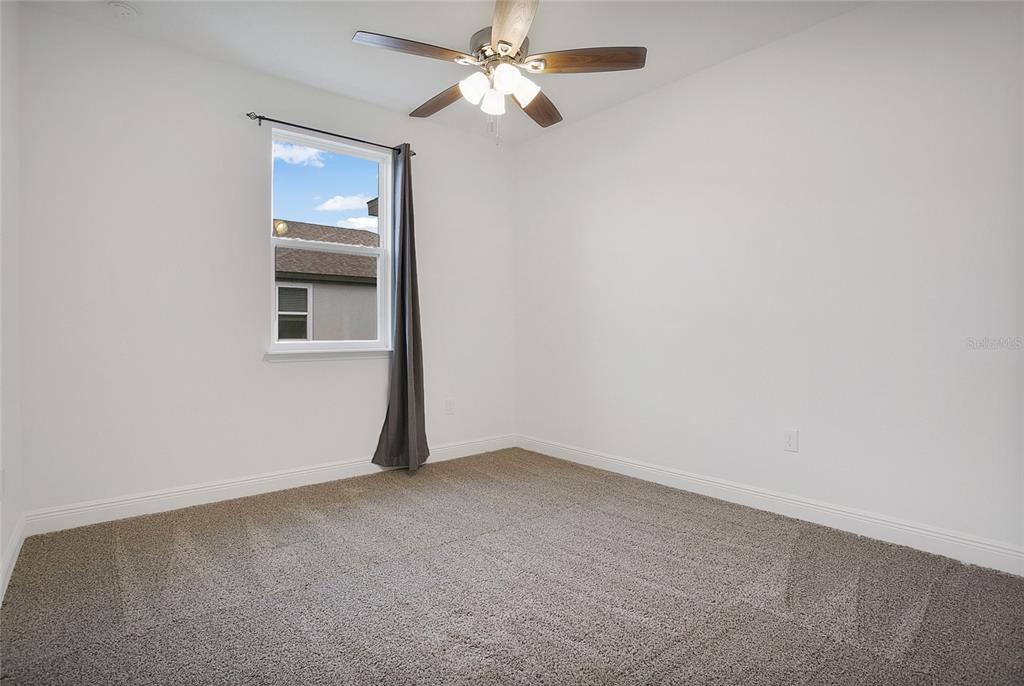 2460 Firstlight Way Winter Park, FL 32792 - Photo 15 of 24 an empty room with a window and a fan