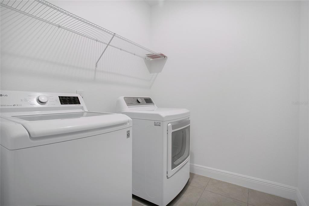 2460 Firstlight Way Winter Park, FL 32792 - Photo 18 of 24 a utility room with dryer and washer