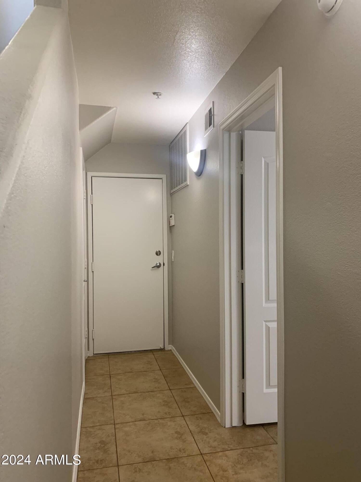 280 South Evergreen Road, Unit 1297 Tempe, AZ 85288 - Photo 29 of 51 1st Floor BDRM Entrance & Garage