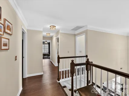 a view of hallway with wooden floor