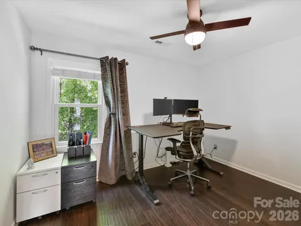 a work room with furniture and a window