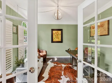 a view of a livingroom with furniture and windows