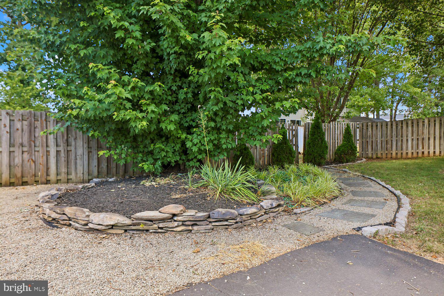 15764 Beau Ridge Drive Woodbridge, VA 22193 - Photo 48 of 58 a view of a backyard with green space