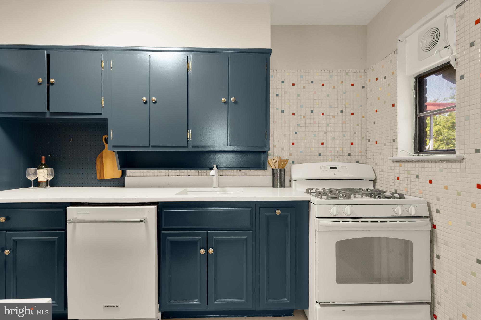 3984 Ames Street Northeast Washington, DC 20019 - Photo 7 of 16 a kitchen with a sink stove and cabinets