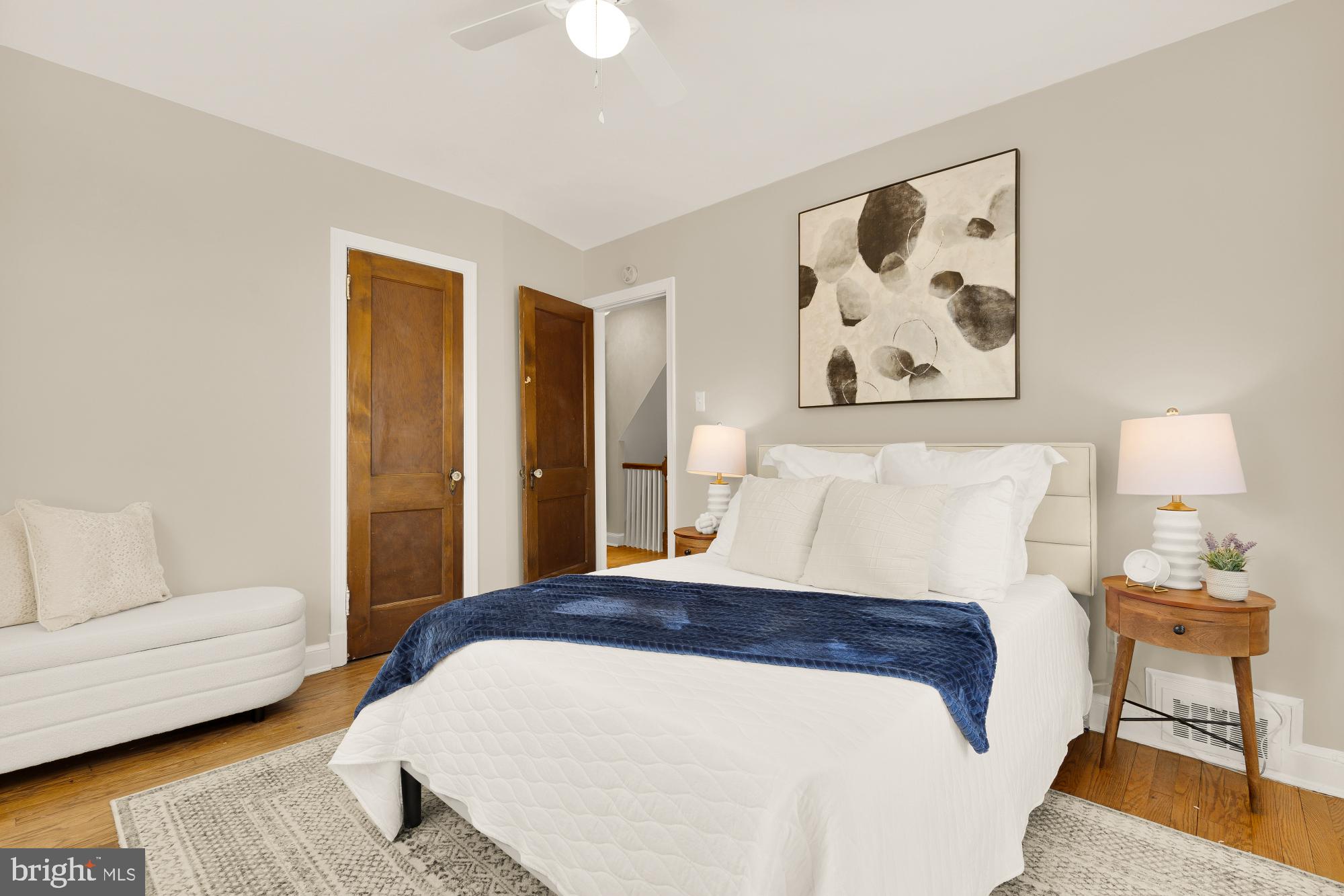 3984 Ames Street Northeast Washington, DC 20019 - Photo 10 of 16 a spacious bedroom with a bed and a couch