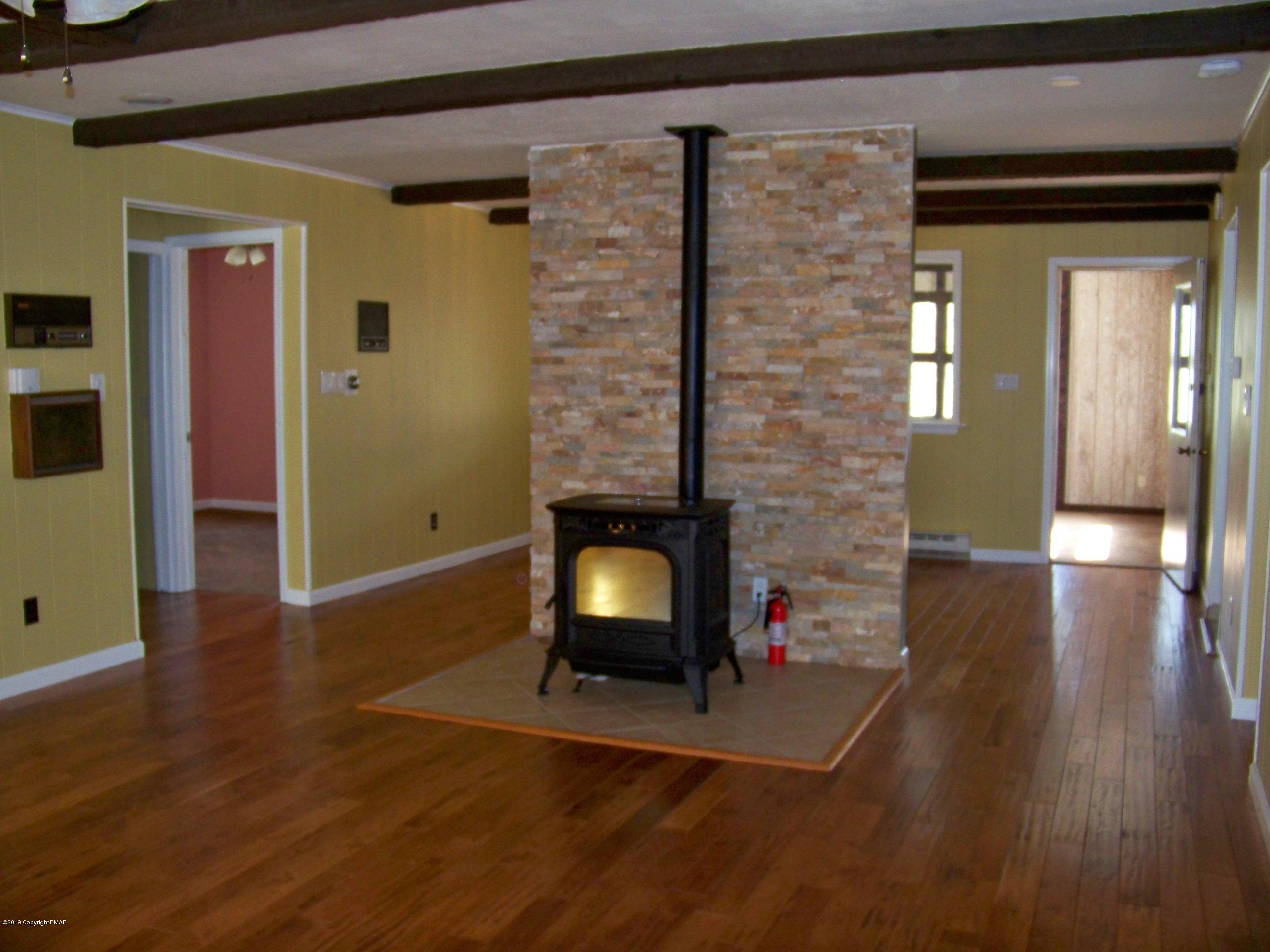 1180 Valleyview Circle Bushkill, PA 18324 - Photo 4 of 26 Living Room view into Dining Area