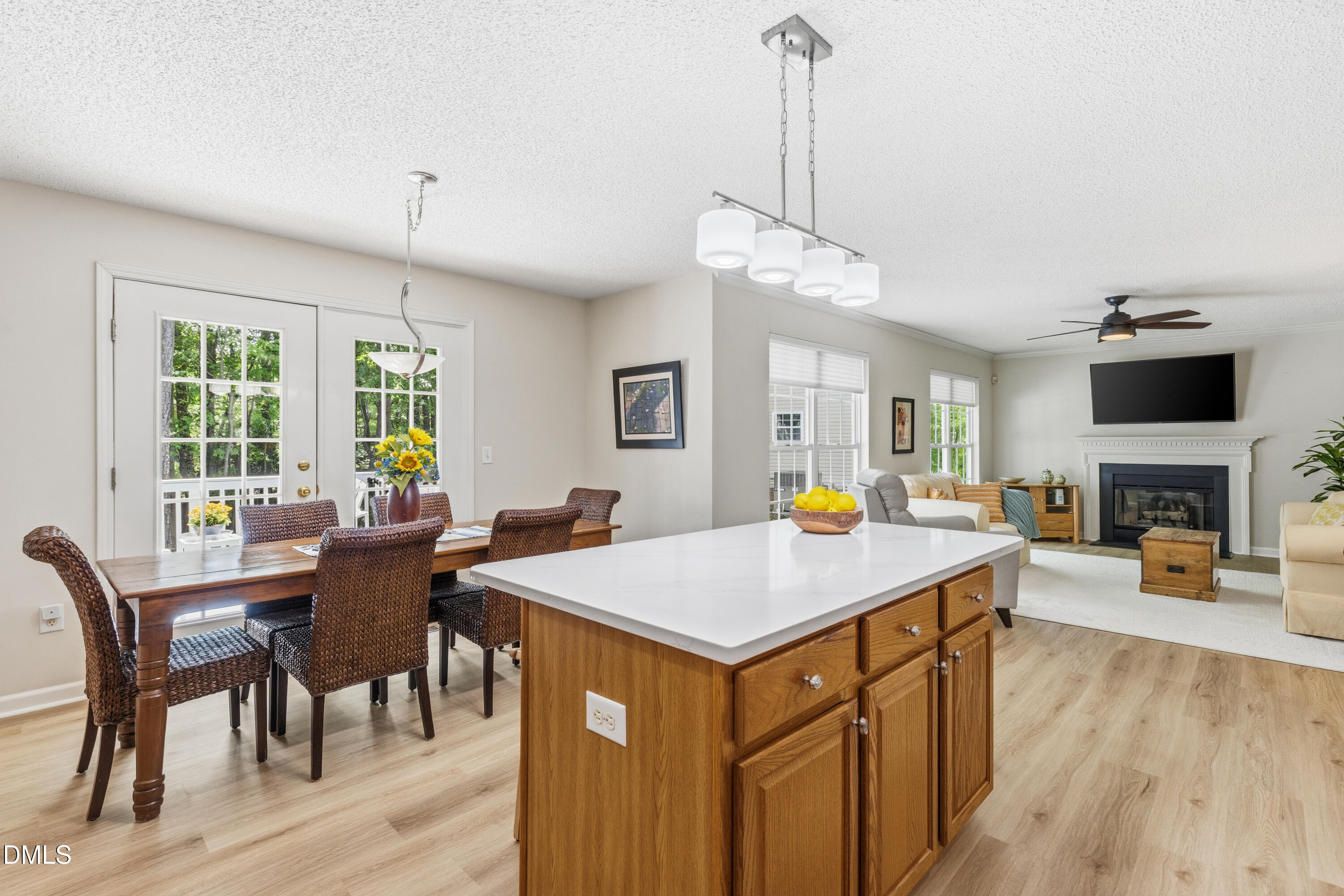 1211 Waterford Green Drive Apex, NC 27502 - Photo 20 of 53 a view of a dining room and a wooden floor