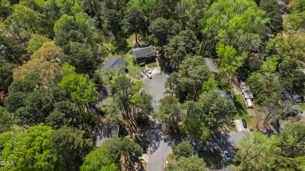 an aerial view of a house with a yard