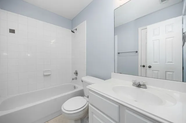 a bathroom with a sink a toilet and a bathtub