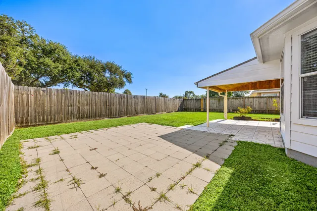 a view of backyard with green space