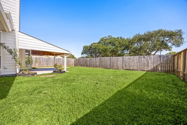 a view of backyard with green space