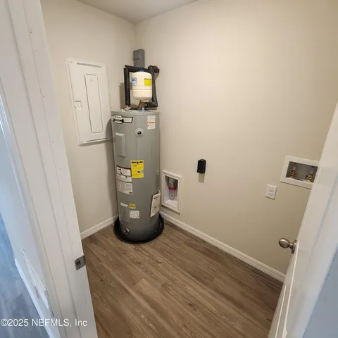a view of storage and utility room with a sink