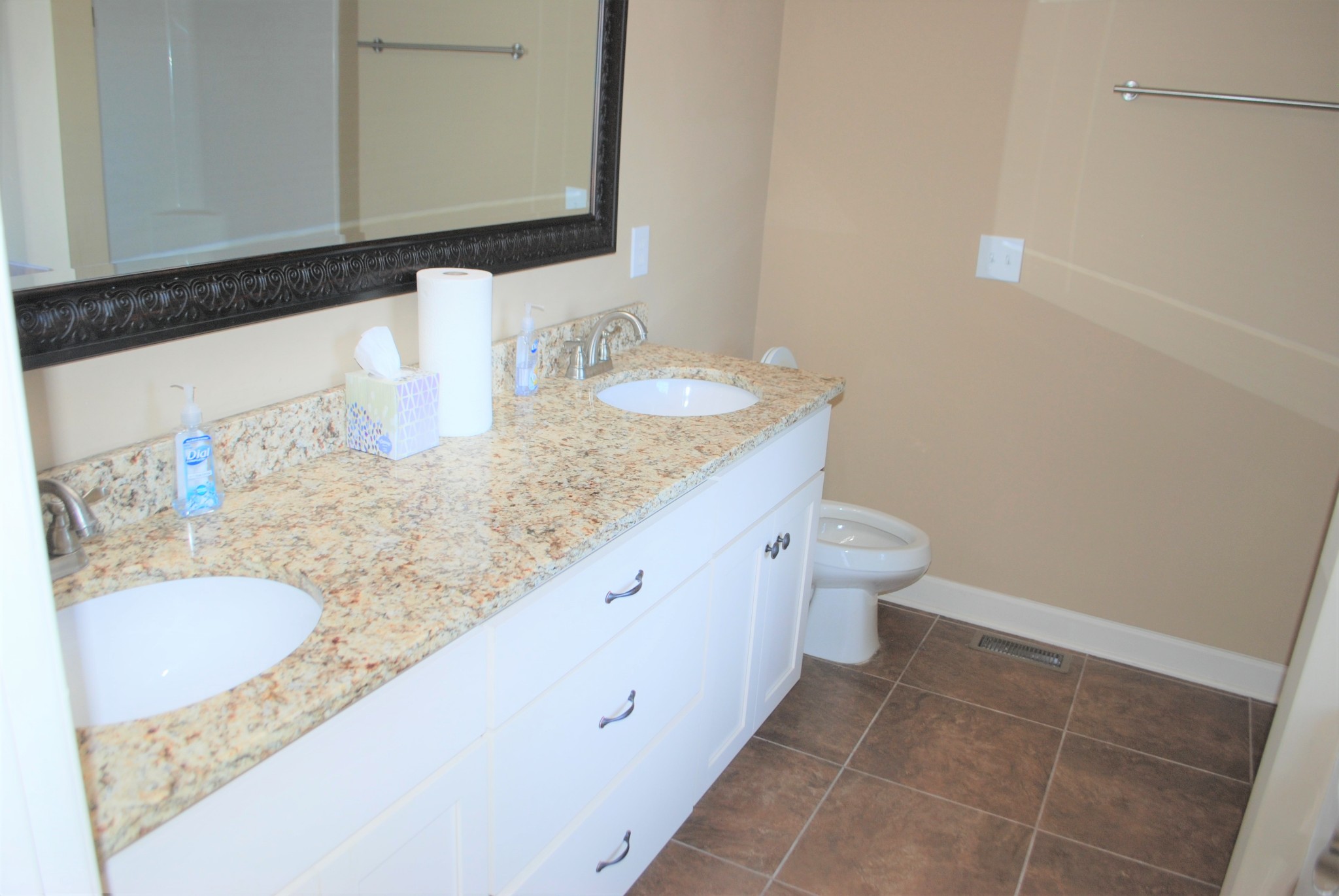 82 Diamond Road Manchester, TN 37355 - Photo 7 of 18 a bathroom with a granite countertop sink a toilet and a mirror
