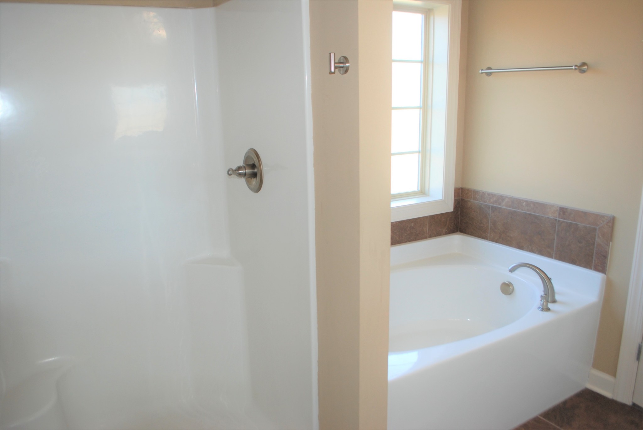 82 Diamond Road Manchester, TN 37355 - Photo 10 of 18 a white bath tub sitting next to a window