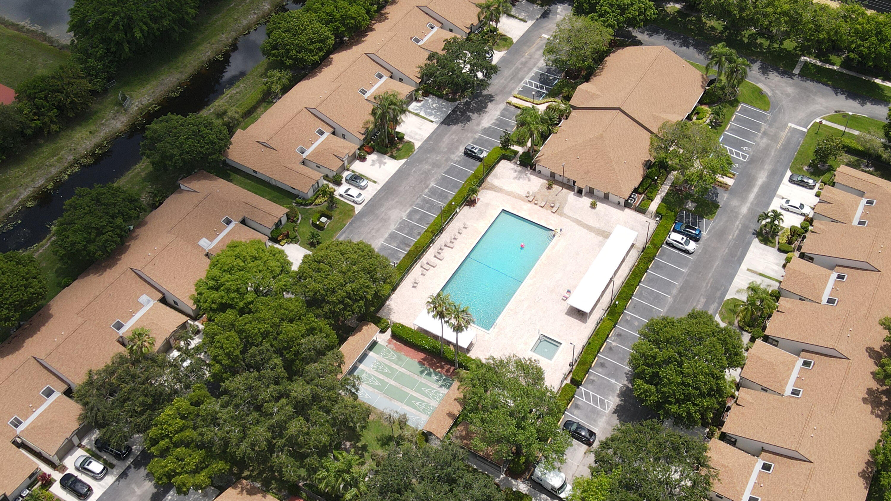 8246 Springview Terrace Boca Raton, FL 33496 - Photo 49 of 53 an aerial view of a house with a yard and trees