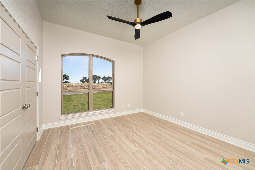 4249 Cold Springs Road Kempner, TX 76539 - Photo 32 of 48 wooden floor in an empty room with a window