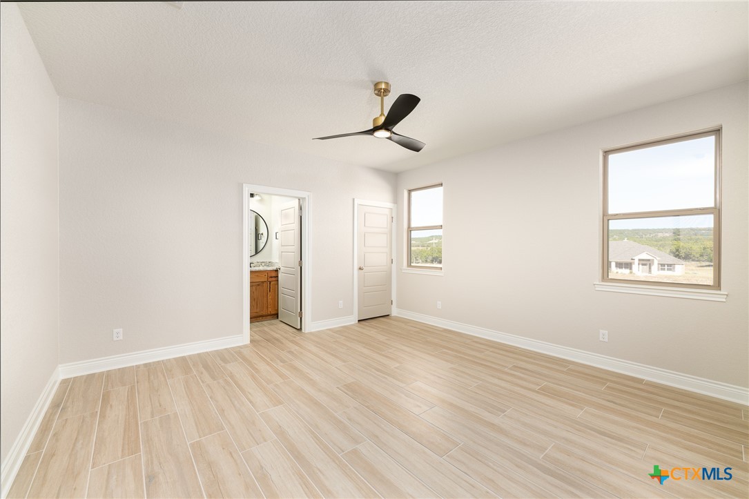 4249 Cold Springs Road Kempner, TX 76539 - Photo 34 of 48 wooden floor in an empty room with a window