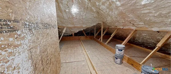 a view of an empty room with a swimming pool