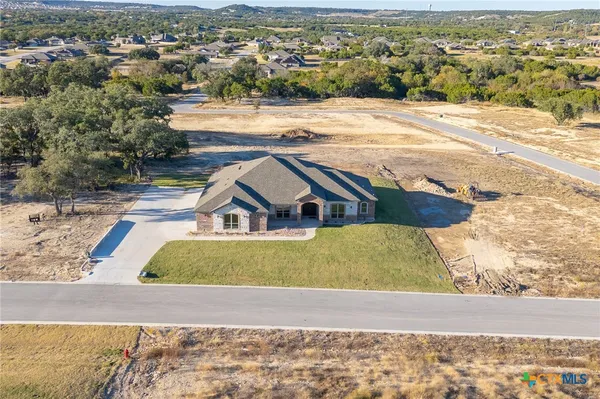 an aerial view of a house with a lake view